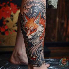 a man with a tattoo on his leg has a red fox and waves behind him