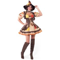 a woman dressed in a costume and boots posing with her hands on her hips while wearing a hat