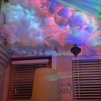 the ceiling is covered in colorful clouds and palm trees, as well as shutters