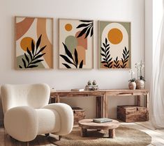 a living room with three paintings on the wall