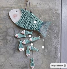 a group of fish hanging on a wall