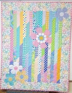 a colorful quilt hanging on the wall