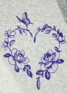 a heart with flowers and butterflies drawn on it