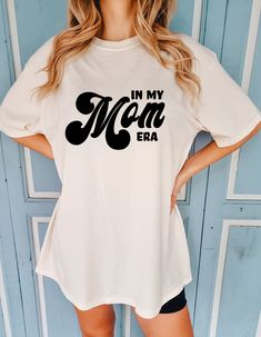 In My Mom Era Comfort Colors Shirt, Mom Era Shirt, Newly Mom shirt, Mom to be, Mama Shirt, Gift For Mom, Mama Era, Mother's Day Gift, Mother 🎈WELCOME TO UNIQUE TRENDS DESIGN  If you are looking for soft, comfy, first-rate t-shirts, you're in the right place! Here at Unique Trends Design, we love what we do and strive to make your shopping experience just right for you. If you have any questions, concerns, or comments about our products, feel free to shoot us a message anytime. Even on weekends and holidays, we'll try our best to respond as quickly as possible! 🎈Product Details  Unisex T-Shirt: - Comfort Colors Brand - 100% cotton - Light/medium weight and extremely soft, this shirt is sure to be your next favorite t-shirt. 🎈Sizing and Coloring  Please make sure you select the right colo Trending Tee Shirt Designs, Mom Era Shirt, In My Mom Era Shirt, Mom T Shirt Ideas, Mother’s Day Shirts, Mama Shirts Vinyl, Mom Sayings For Shirts, Mother Day Outfit, Motherhood University