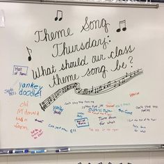 a white board with writing on it and notes attached to the wall behind it that says, home song thunders what should our class sound like?