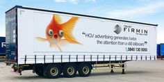 a semi truck with a goldfish advertisement on the side