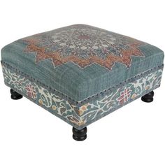 a blue ottoman with an ornate design on it