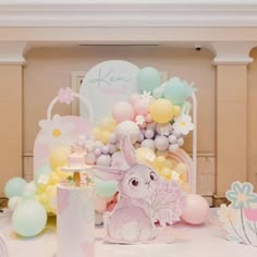 a table with balloons and decorations on it