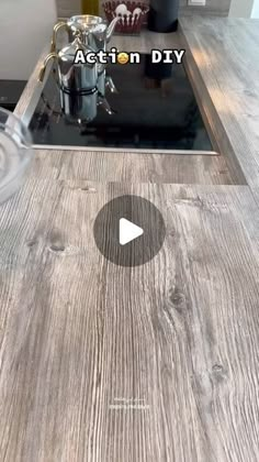 a kitchen counter top with an appliance in the middle and a video playing on it