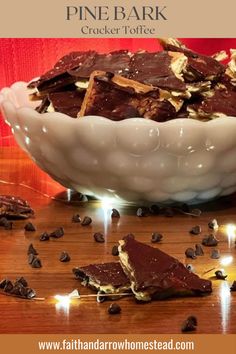 a white bowl filled with chocolate and nuts