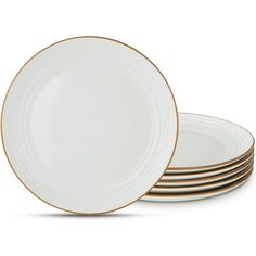 white and gold dinner plates stacked on top of each other in front of a white background