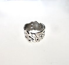 I hand carved this ring out of wax, and had it casted into sterling silver. It is one of a kind, and free form that changes pattern all the way around. The band is thick, as shown by the picture with the ruler. Wax Carved Ring, Jewelry 2024, Wax Ring, Silver Core, Wax Carving, Carved Ring, Lost Wax, Couple Rings, Silver Band