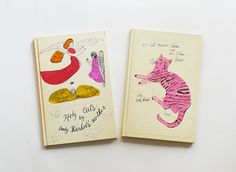 two children's books with drawings on them