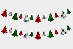 christmas trees are hanging from a string on a white background with black and red checkered fabric