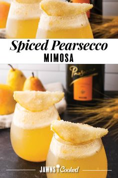 two glasses filled with spiced pearseco mimosa on top of a table