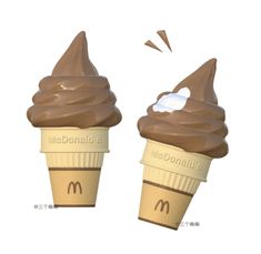 two ice cream cones with chocolate toppings on them