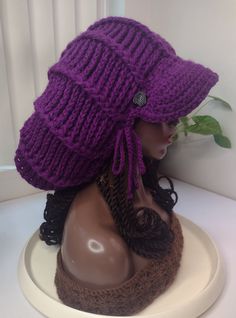 ** The Orchid Dark Purple L Mushroom hat is ready to ship, to order other colors use the other listings thank you ** ► ITEM DESCRIPTION ITEM NAME: L Mushroom Hat brim Applejack  ♦ Brim has a wired outer edge so the it is moldable and holds whatever shape you shape it to.  ♦ Can wear hair tucked in the hat or over the hair, letting the hair hang loose ♦ Logo label is sewn to the inside of the hat. ♦ A hidden drawstring that is functional is used around the lower edge for a custom, snug, stretch-proof fit.  ♦The satin option has a comfort satin band on the inner lower edge to protect hair edges ► MATERIALS Made of 100% colorfast acrylic yarn ► CARE INSTRUCTIONS ♦ Hand wash and Air dry ► CUSTOM OPTIONS ♦ If you would like custom options not shown in the drop down menus, please send a message Hair Tuck, Mushroom Hat, Purple L, 70s Hippie, Hang Loose, Logo Label, Protective Hairstyles, Dark Purple, Acrylic Yarn