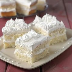 two pieces of cake sitting on top of a white plate next to another piece of cake