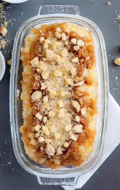 a casserole dish with nuts and crumbled toppings on the top