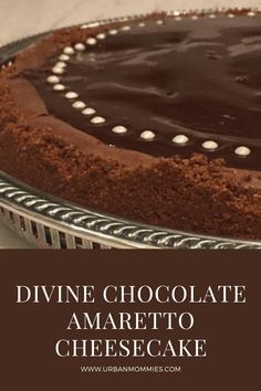 a chocolate cheesecake on a plate with the words divine chocolate amareto cheesecake