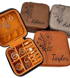 four leather jewelry cases with rings and bracelets in them