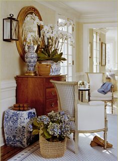 an instagram page with flowers and vases on the side table in front of a mirror