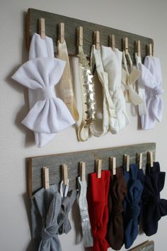 there are several pairs of bow ties hanging on the wall