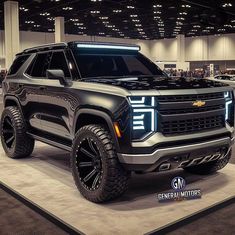 the chevrolet truck is on display at an auto show