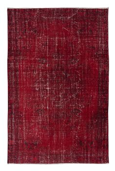 an old red rug with faded edges