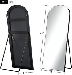 a large mirror next to a stand with a coat hanging on it's side