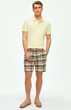 Soft cotton madras woven in a bright plaid brings sunny-day comfort to shorts styled with a classic flat front and a relaxed, all-occasion feel. 7" inseam; 20" leg opening; 11" front rise; 15" back rise (size 32) Zip fly with button closure Front slant pockets; back button-welt pockets 100% cotton Dry clean or machine wash, tumble dry Imported Classic Plaid Cotton Bottoms, Casual Plaid Cotton Shorts, Fitted Plaid Casual Shorts, Fitted Casual Plaid Shorts, Preppy Summer Shorts With Pockets, Casual Plaid Bottoms With Welt Pockets, Casual Plaid Shorts, Preppy Plaid Bottoms For Summer, Preppy Plaid Cotton Shorts