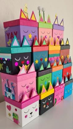 many colorful boxes are stacked on top of each other