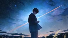 a man standing in the grass looking at his cell phone under a sky full of stars