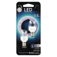 two light bulbs in packaging on a white background, one is purple and the other is blue