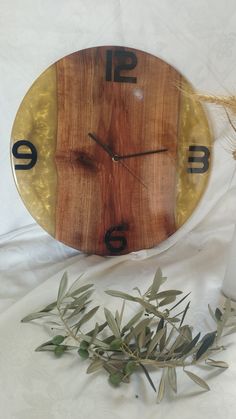 a wooden clock sitting on top of a table