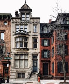 an old brick building with many windows and balconies