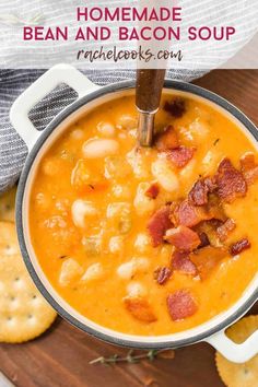 homemade bean and bacon soup in a pot with crackers