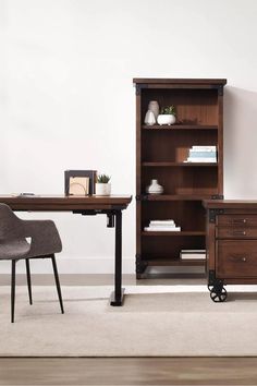 an office with a desk, chair and bookcase