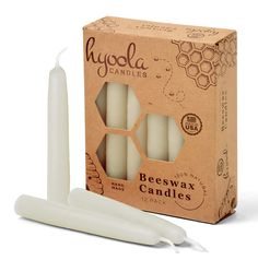 beeswax candles are packaged in a cardboard box