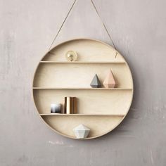 an image of a round shelf hanging on the wall