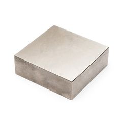 a square metal object on a white background