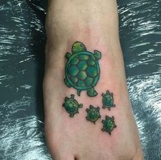 a small turtle tattoo on the foot