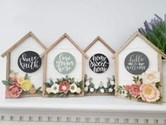 four small wooden houses decorated with flowers