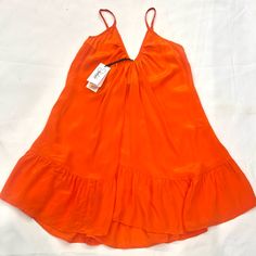 Nwt Shahida Parides Dress In Sunset 100% Silk Size: M / Beautiful Color And Material V-Neck Front, Scoop Back V-neck Ruffled Sundress For Daywear, Lined V-neck Midi Dress For Vacation, Lined V-neck Sundress, Brunch V-neck Lined Sundress, Unlined V-neck Vacation Dress, Orange Ruffle Hem Beach Dress, Orange Beach Dress With Ruffle Hem, Orange Ruffle Hem Dress For Beach, Orange V-neck Midi Dress With Ruffles