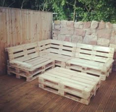 several wooden pallets are stacked on top of each other to create a seating area