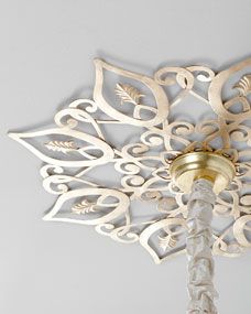 a white chandelier hanging from the ceiling