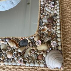 a mirror with shells and seashells on it