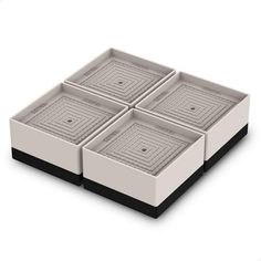 four square trays sitting on top of each other