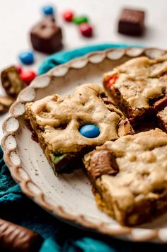 a white plate topped with cookies and candy bars