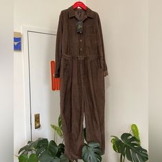 This Listing Is For A Needles Japan Brown Corduroy All In One Jumpsuit. It Is New With Tags. Measurements. Size Small Pit To Pit: 22 Arm: 20.5 Back: 26.25 Cotton-Blend Corduroy Overalls. - Spread Collar - Four-Pocket Styling - Zip-Fly - Partial Button Closure - Patch Pocket - Bungee-Style Drawstring At Waist - Single-Button Barrel Cuffs Supplier Color: Black This Item Is Fulfilled By Ssense Fit Tip Fits True To Size. Fabric / Material Cotton-Blend Overall. Cover All Cheap Brown Corduroy Bags, Cheap Brown Corduroy Outerwear, Cheap Corduroy Outerwear With Buttoned Pockets, Needles Japan, Corduroy Jumpsuit, Corduroy Overalls, Brown Corduroy, Men's Coats And Jackets, Mens Coats